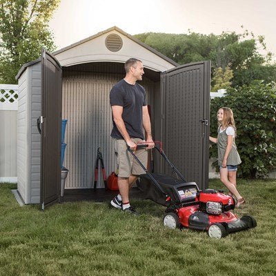 8x5 shed with doors open and a lawn mower inside