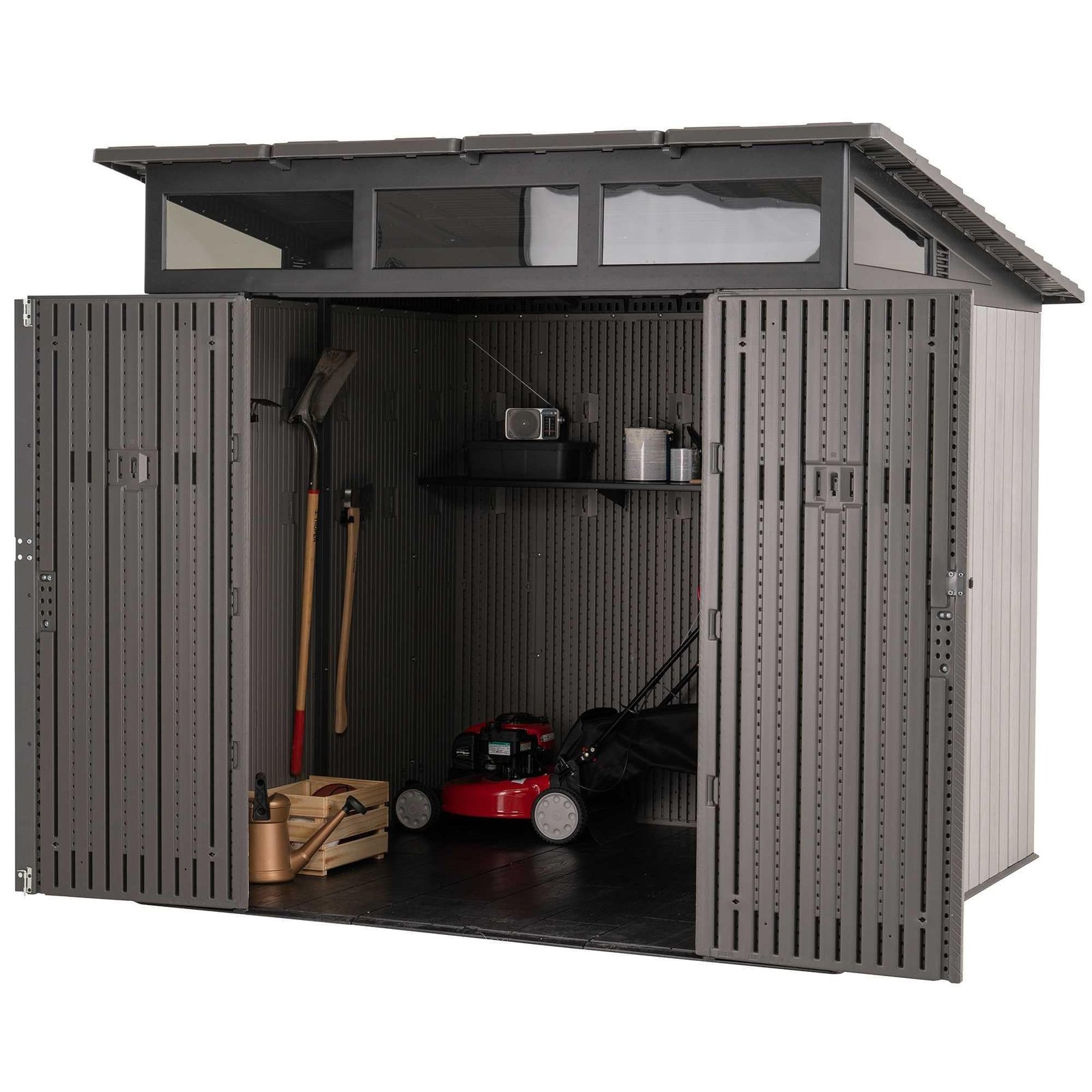 Farmhouse shed with doors open showing a lawn mower inside